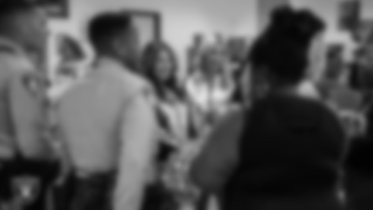 Raiderettes Katsura and Madison E. talk with members of the Las Vegas Metropolitan Police Department Northeast Area Command.