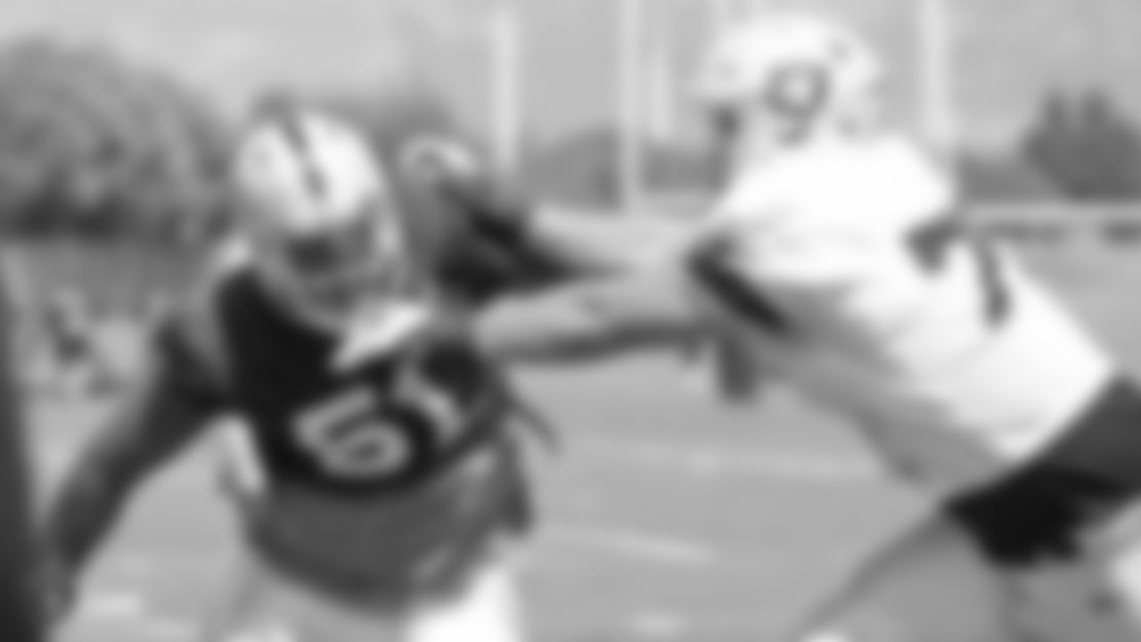Oakland Raiders defensive end Bruce Irvin (51) and guard Kolton Miller (77) on the field for a preseason practice at the Oakland Raiders Practice Facility, Monday, August 27, 2018, in Alameda, California.