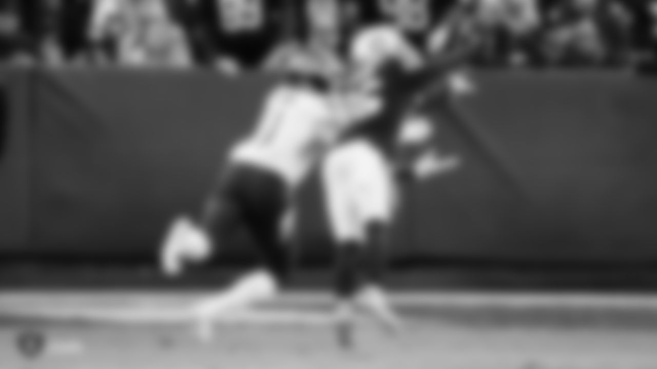 Raiders cornerback Nevin Lawson (26) breaks up a pass during the regular season game against the Tennessee Titans.