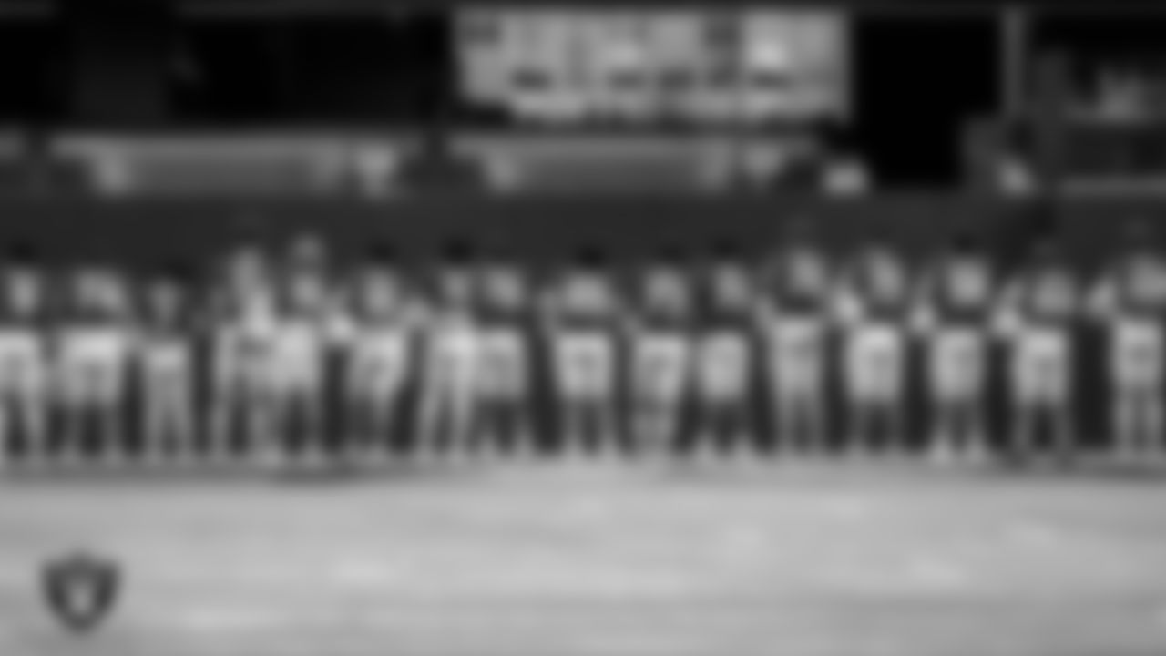 Bishop Gorman High School players during the national anthem before their game against Robert McQueen High School during the NIAA Class 5A State Football Championship at Allegiant Stadium.