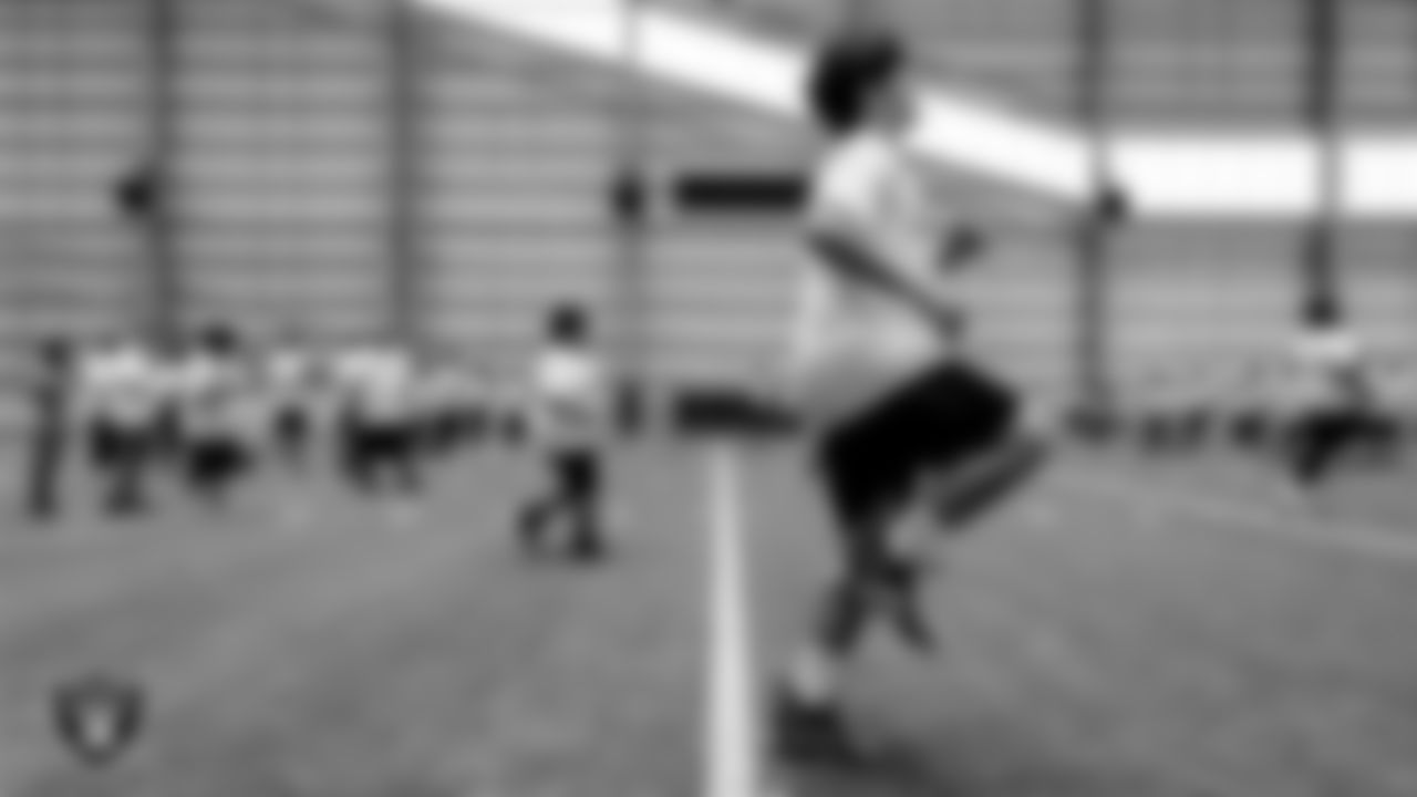 An athlete warms up before drills during the ELITE Academy at the Las Vegas Raiders Headquarters.