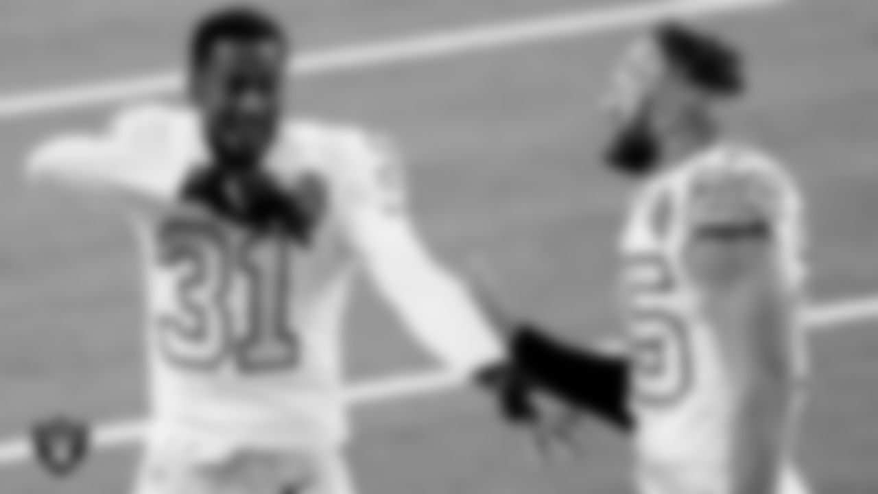Las Vegas Raiders cornerback Isaiah Johnson (31) and safety Erik Harris (25) celebrate on the field after the regular season away game against the Los Angeles Chargers.