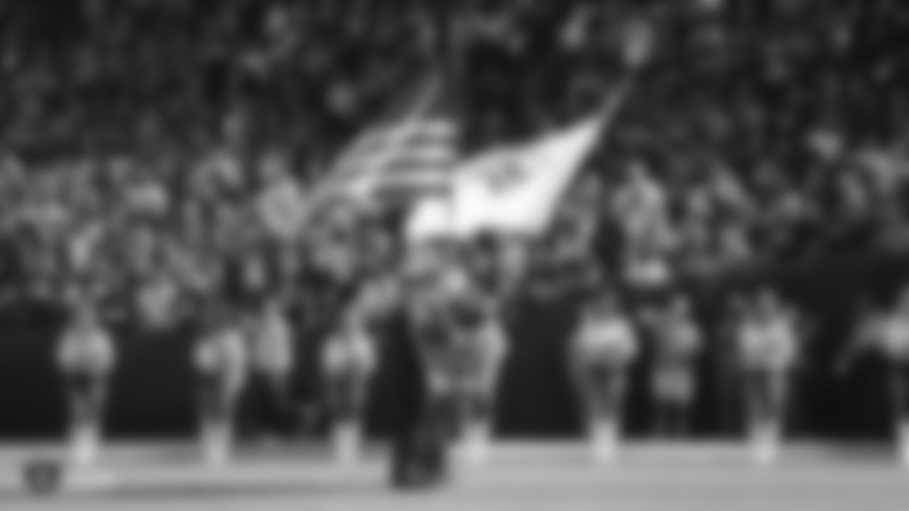 Members of the military present the nation's colors during the national anthem before the Raiders regular season game against the Cincinnati Bengals.