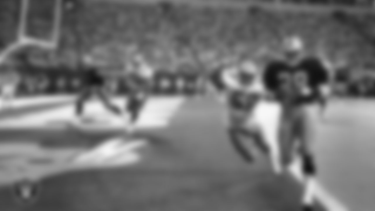 Los Angeles Raiders running back Greg Bell (28) makes a 2-yard touchdown catch during the preseason away game against the Dallas Cowboys at Texas Stadium, Monday, August 12, 1991, in Irving, Texas.