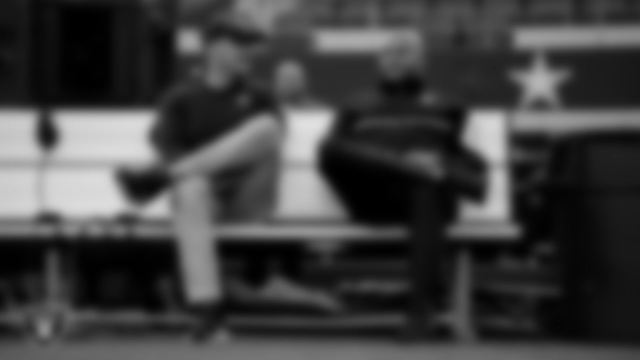 Las Vegas Raiders offensive quality control coach Mitch Singler and linebackers coach Antonio Pierce on the bench before the preseason away game against the Dallas Cowboys at AT&T Stadium.