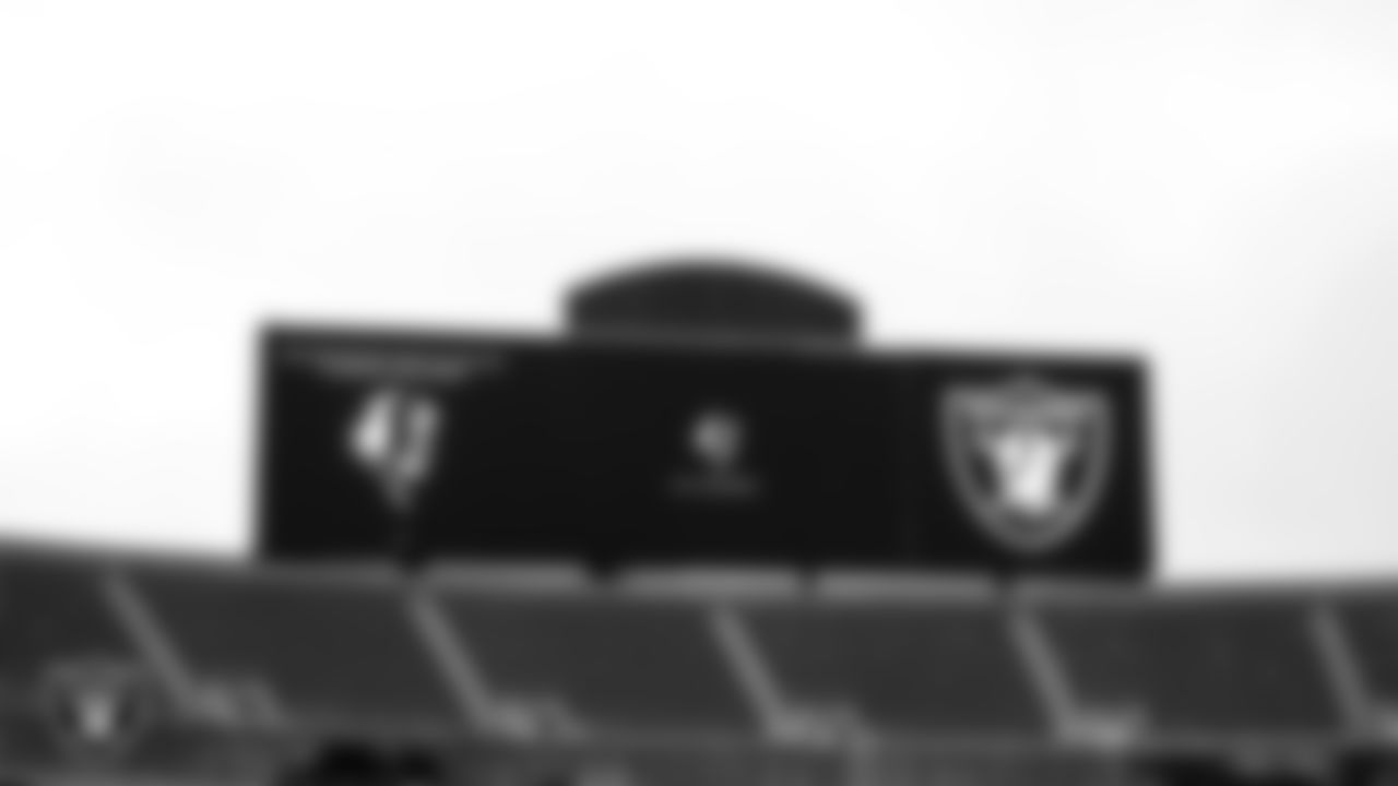 A sign honoring Las Vegas Raiders Hall of Famer John Madden plays on the video board before a memorial service in celebration of his life.