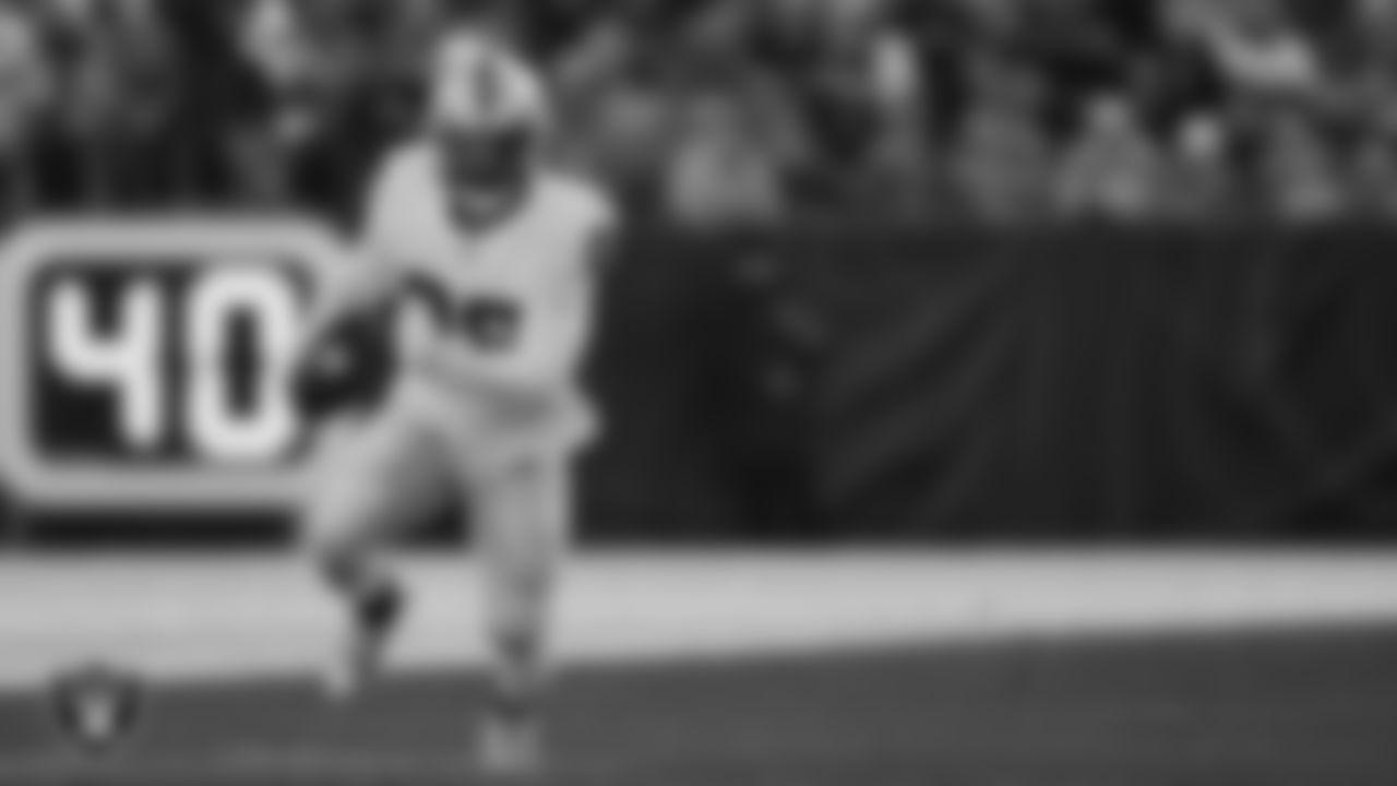 Las Vegas Raiders running back Josh Jacobs (28) rushes during the regular season away game against the Denver Broncos at Empower Field at Mile High.