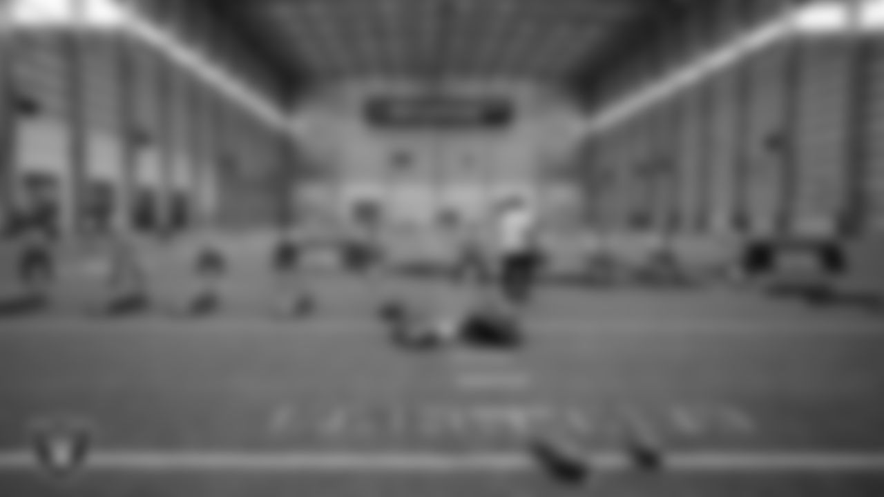 Athletes warm up before drills during the ELITE Academy at the Las Vegas Raiders Headquarters.