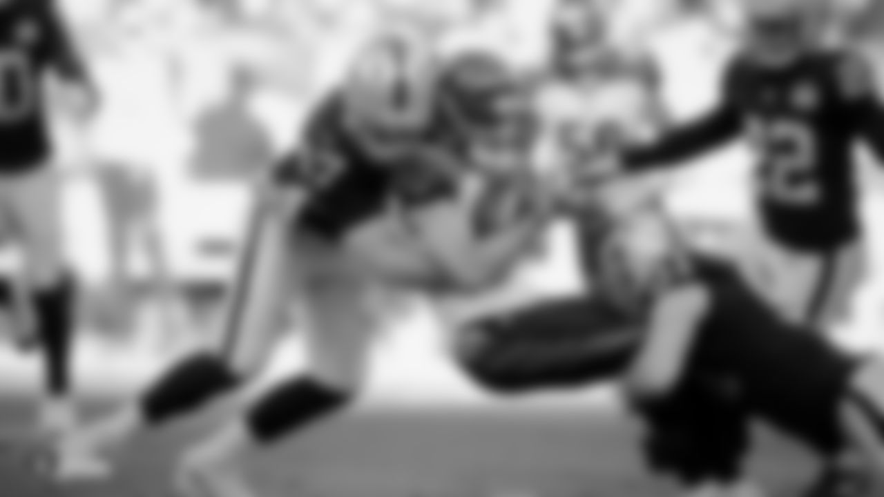 Raiders long snapper Trent Sieg (47) and linebacker Will Compton (51) make a tackle during the regular season game against the Cincinnati Bengals.