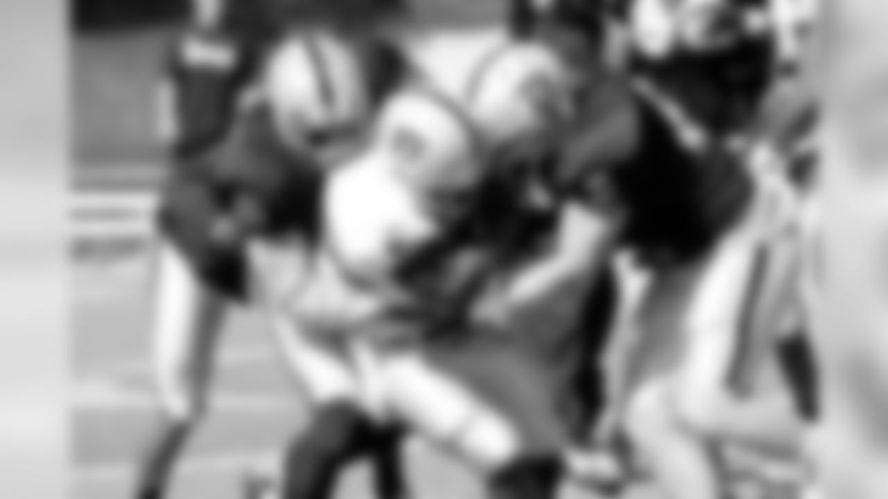 RB Rock Carwright fights through the tackle. Photo By Tony Gonzales