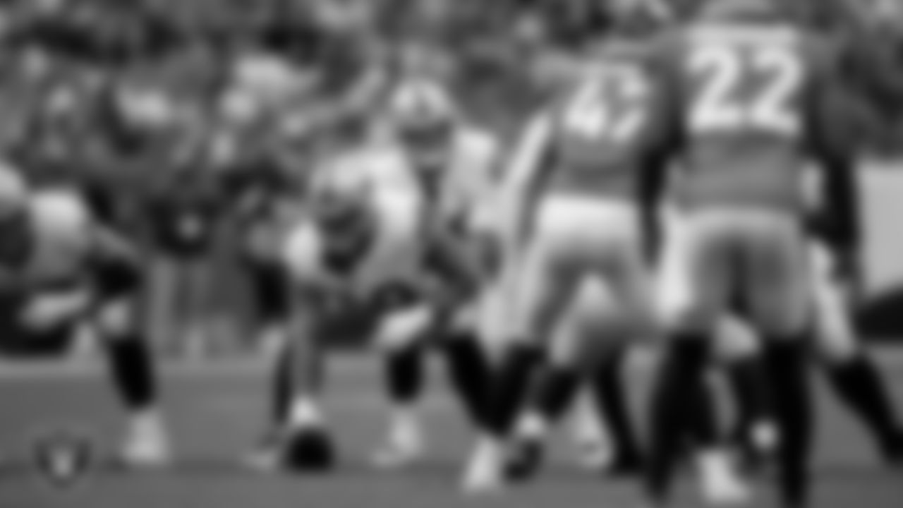 Las Vegas Raiders center Andre James (68) and quarterback Jimmy Garoppolo (10) during the regular season away game against the Denver Broncos at Empower Field at Mile High.