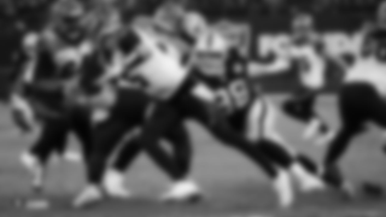 Raiders defensive end Maxx Crosby (98) sacks the quarterback during the regular season game against the Cincinnati Bengals.