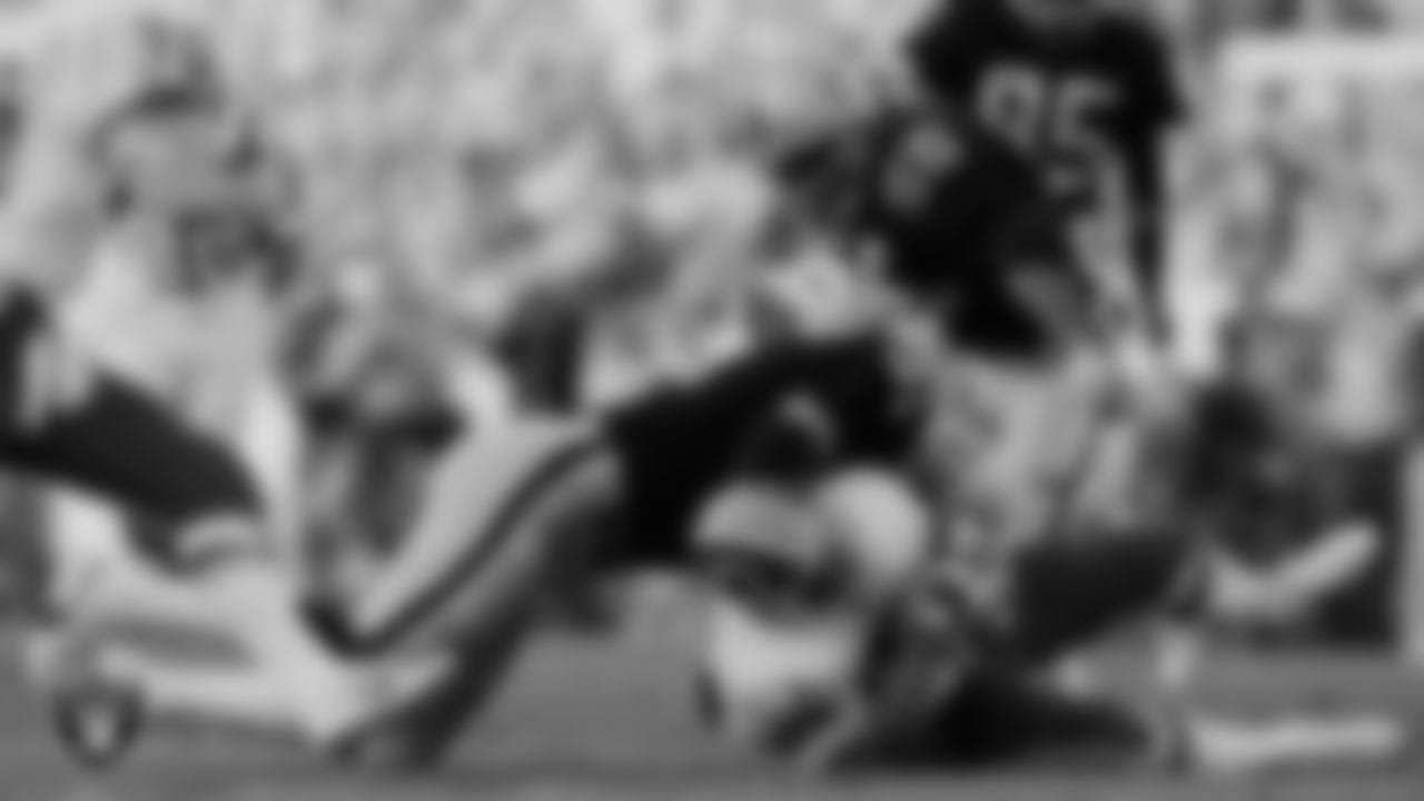 Los Angeles Raiders running back/tight end Derrick Jensen (31) makes a tackle during Super Bowl XVIII against the Washington Football Team at Tampa Stadium, Sunday, January 22, 1984, in Tampa, Fla.