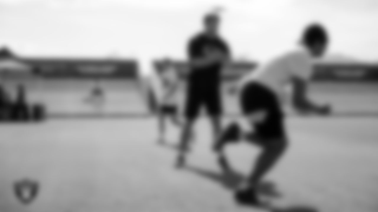 Las Vegas Raiders tight end Michael Mayer (87) works with an athlete during C.H.A.M.P. Camp at Intermountain Health Performance Center.