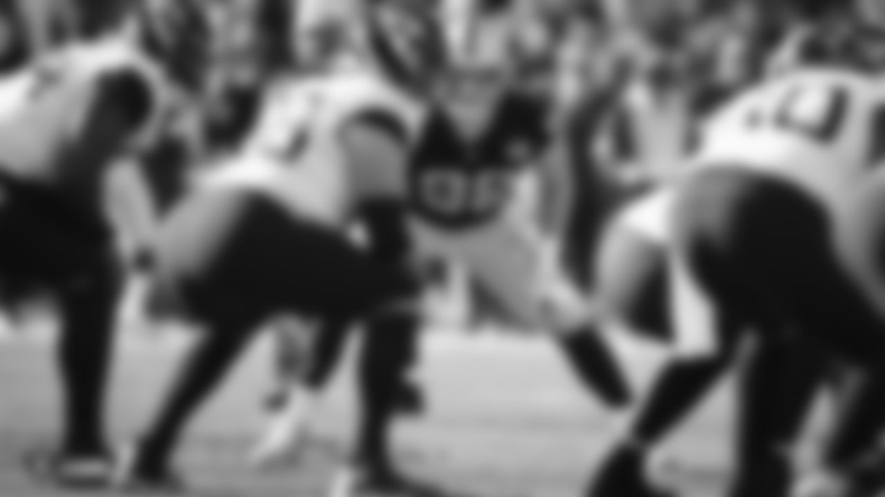 Raiders defensive end Maxx Crosby (98) eyes the quarterback during the regular season game against the Jacksonville Jaguars.