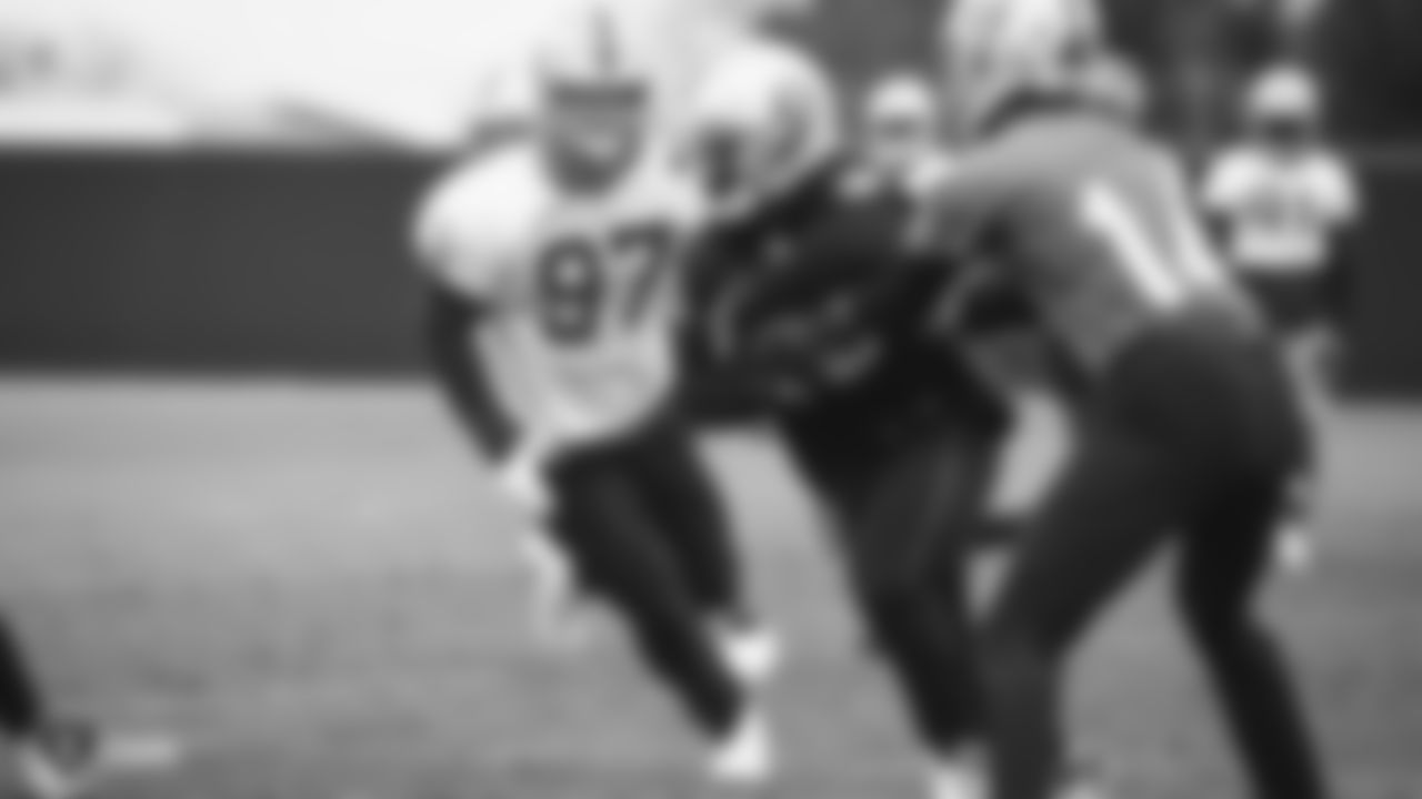 Raiders defensive end Josh Mauro (97) rushes the quarterback during practice.