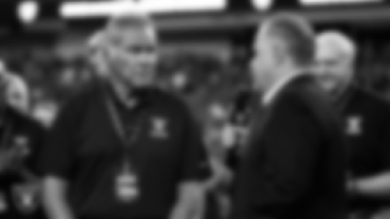 Las Vegas Raiders alumnus Jim Plunkett is interviewed by broadcaster JT the Brick on the field during an alumni celebration at halftime of the Raiders' preseason home game against the New England Patriots at Allegiant Stadium.