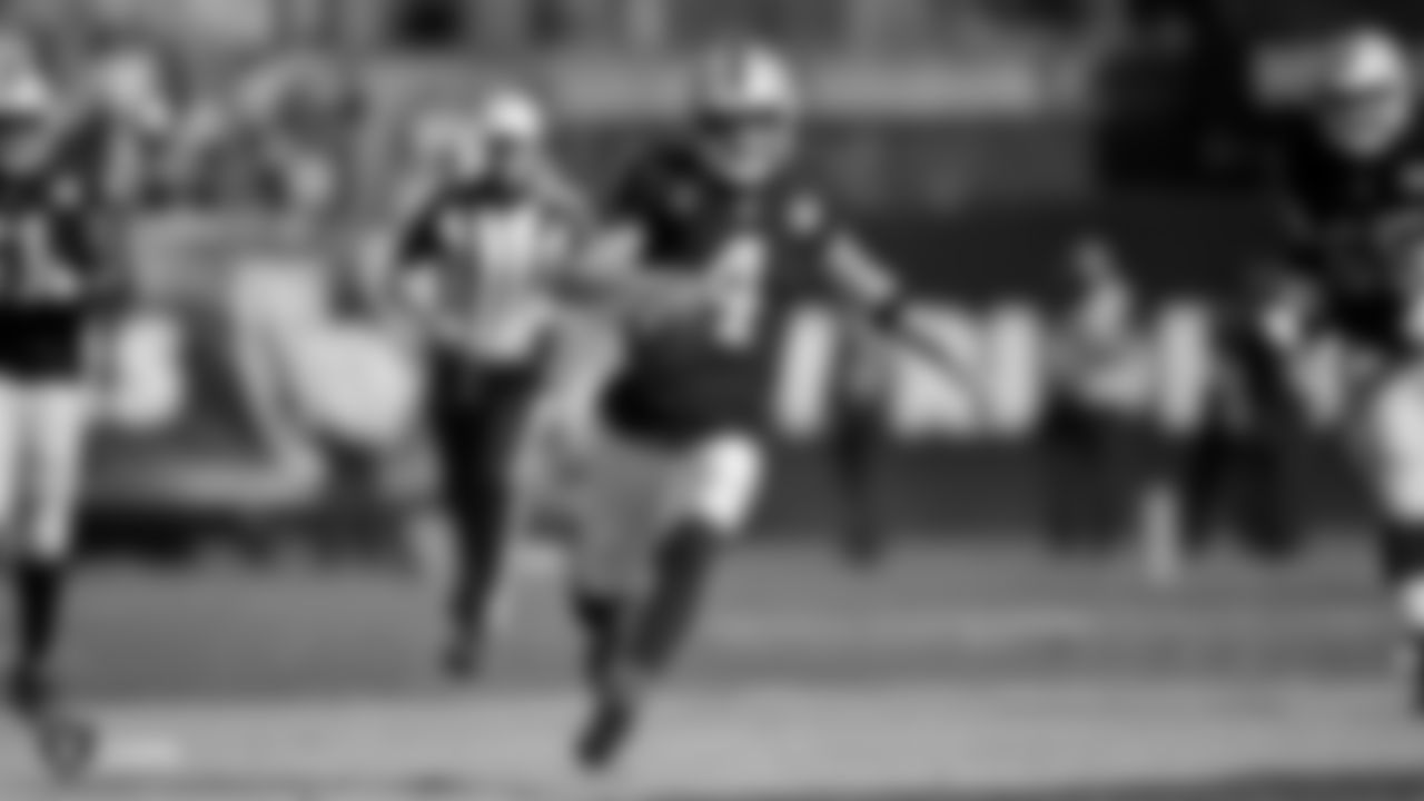 Raiders quarterback Derek Carr (4) rushes for a first down during the Raiders regular season game against the Kansas City Chiefs.