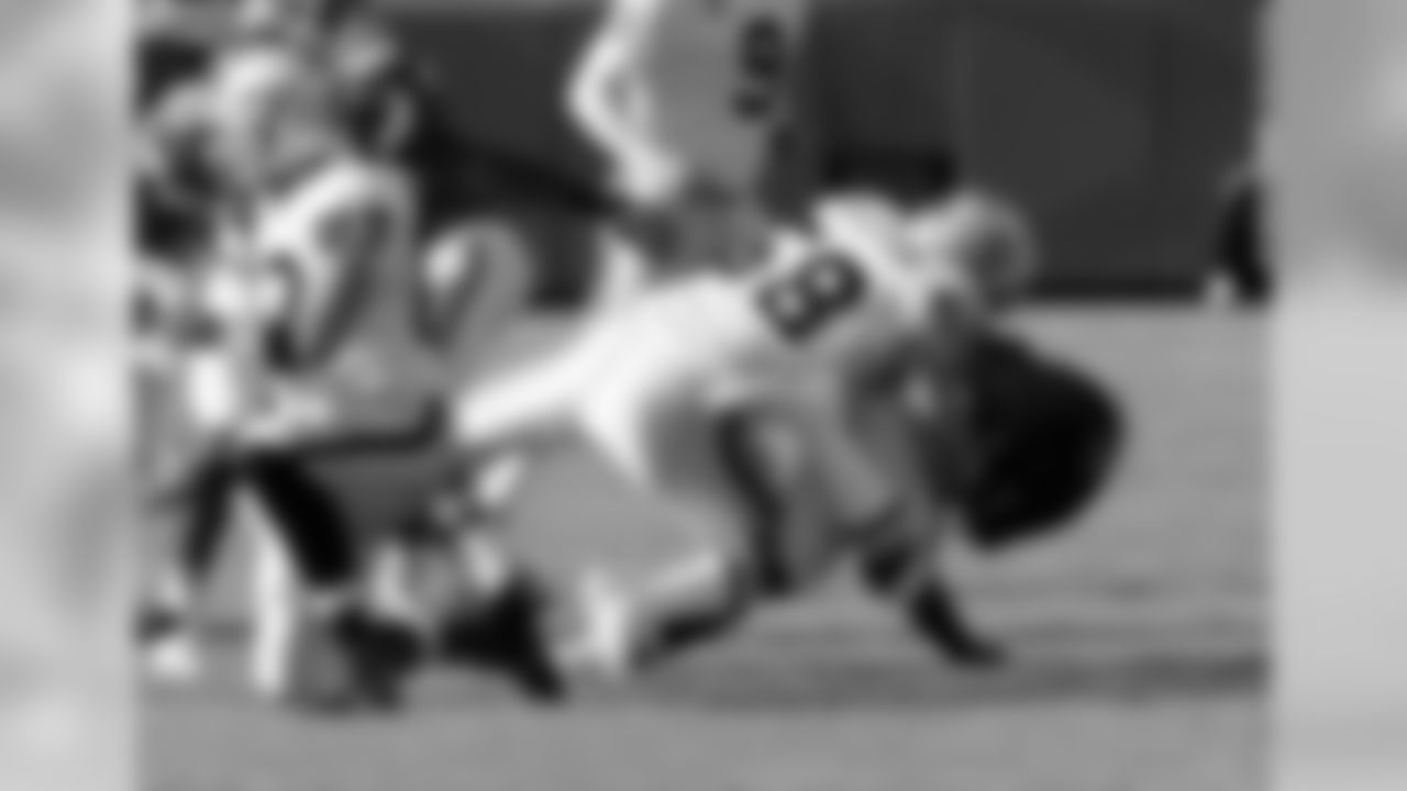 DE David Tollefson makes the tackle.