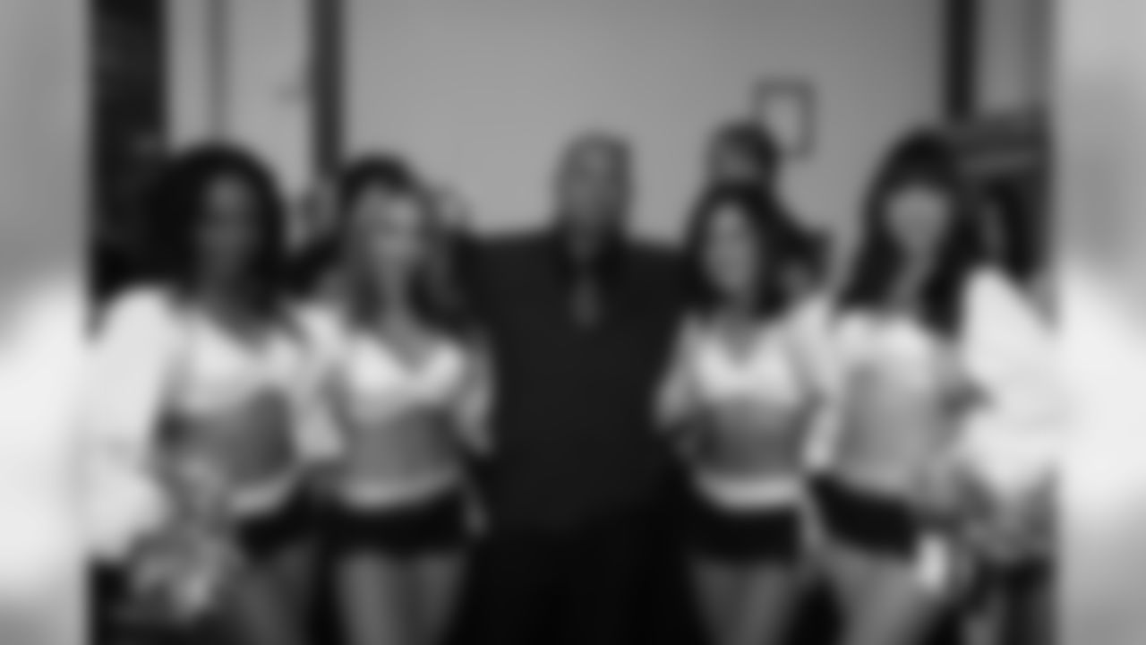 Raiderettes Taliah, Staci, Kathleen and Ashley pose for a photo with a guest.