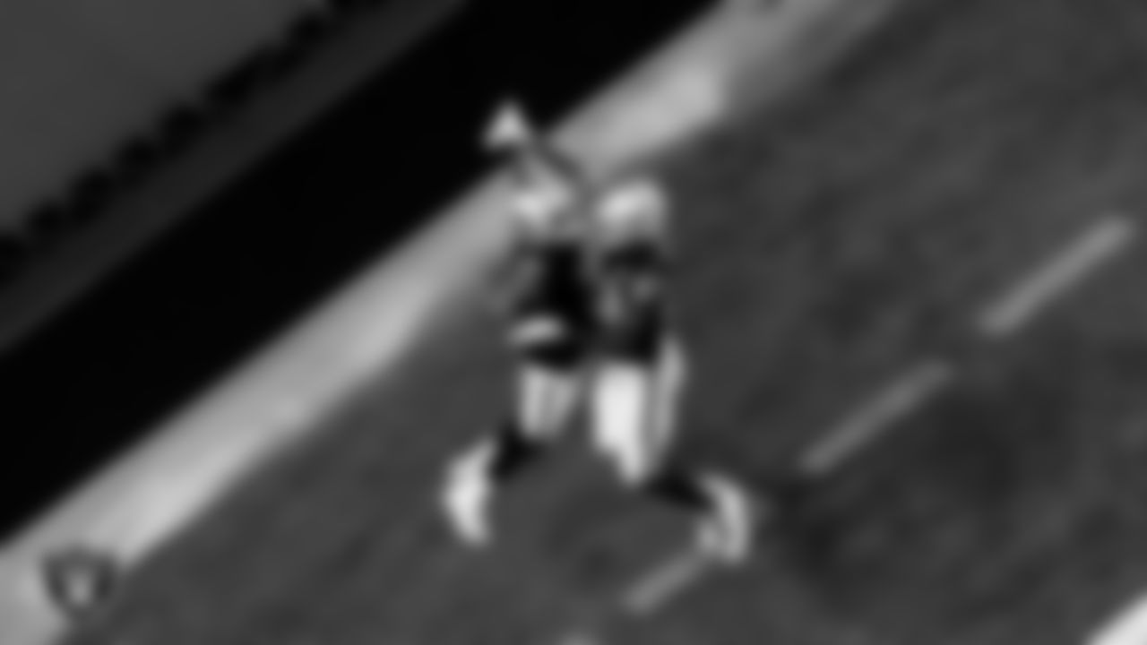 Las Vegas Raiders wide receiver Nelson Agholor (15) celebrates with tight end Darren Waller (83) after making a 17-yard touchdown catch during the regular season home game against the Kansas City Chiefs.