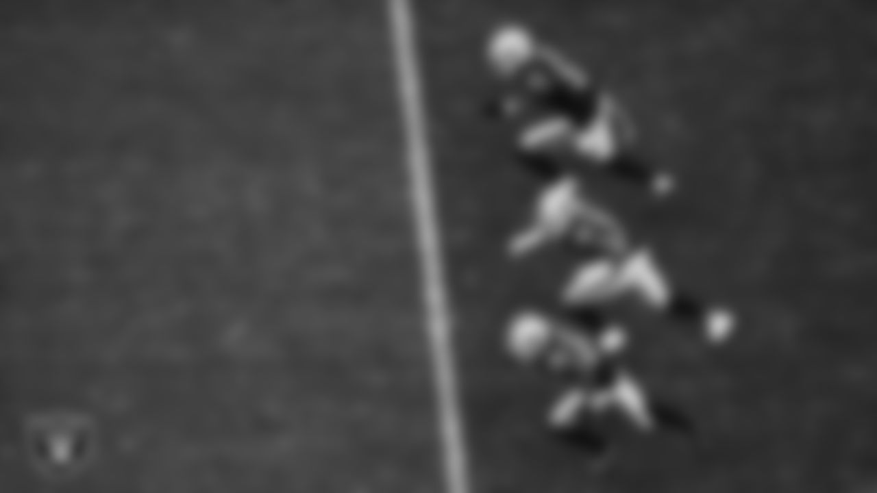 Las Vegas Raiders defensive end Malcolm Koonce (51), linebacker Curtis Bolton (36) and running back Ameer Abdullah (22) head down field after a kick off during the regular season home game against the Kansas City Chiefs at Allegiant Stadium.