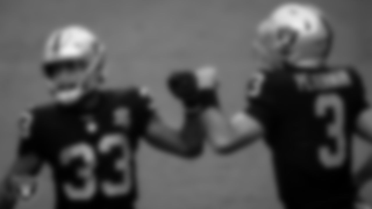 Las Vegas Raiders running back Lynn Bowden Jr. (33) and quarterback Nathan Peterman (3) on the field for practice at 2020 Training Camp.