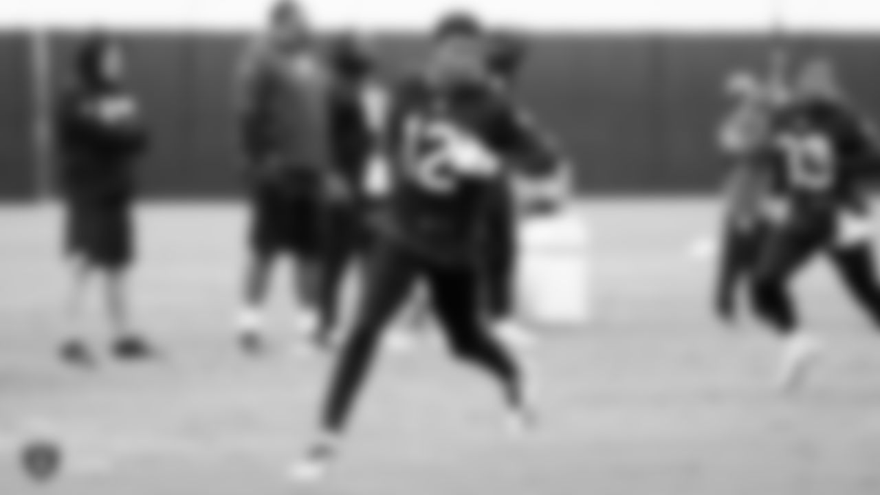 Raiders wide receiver Zay Jones (12) runs a route during a walkthrough.