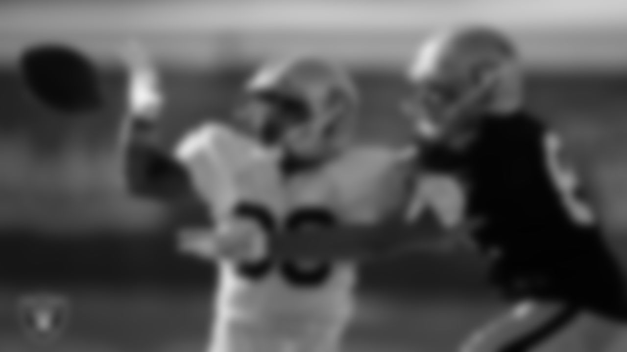 Las Vegas Raiders safety Roderic Teamer (33) and tight end Foster Moreau (87) on the field for practice at 2021 Training Camp.