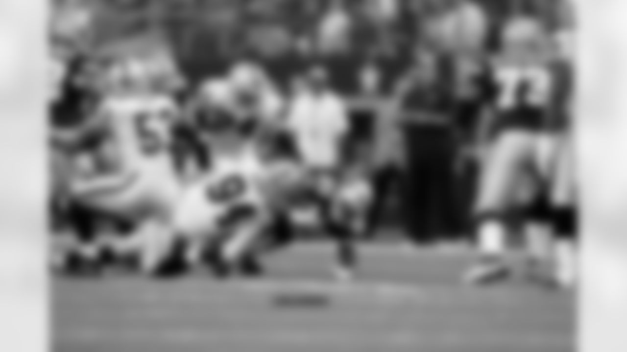 LB Kevin Burnett makes the tackle.