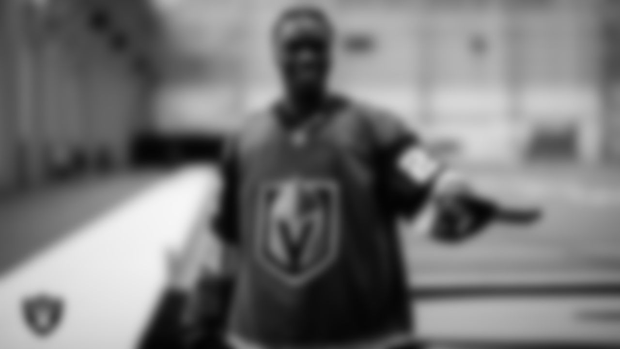 Las Vegas Raiders wide receiver Henry Ruggs III (11) receives a custom Vegas Golden Knights jersey during practice.