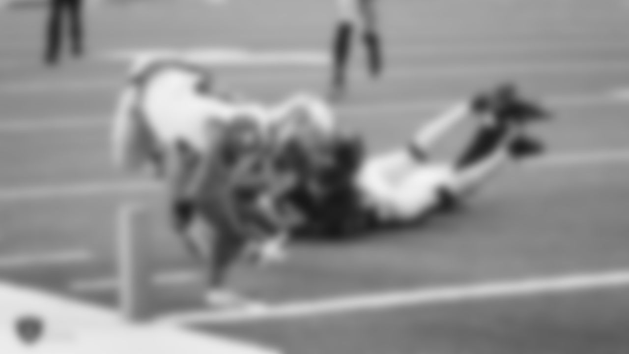 Raiders tight end Darren Waller (83) dives for the pylon for an 8-yard touchdown reception during the regular season game against the Houston Texans.