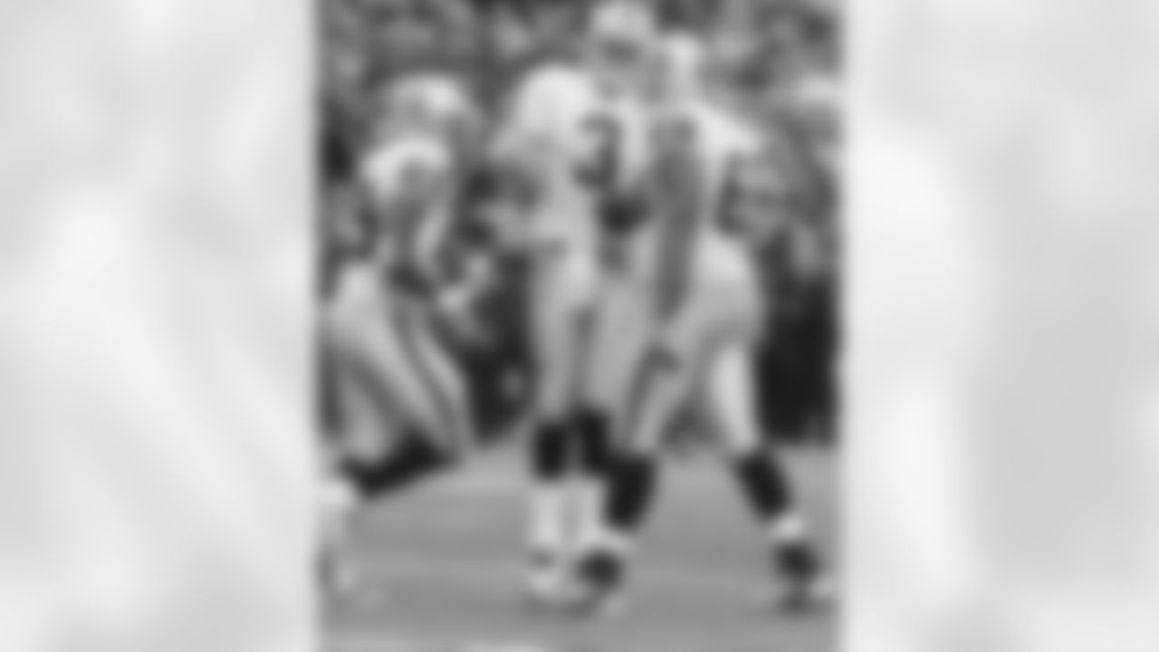 QB Carson Palmer celebrates his touchdown with T Khalif Barnes and RB Michael Bush.