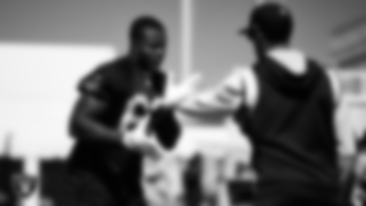Las Vegas Raiders defensive lineman David Agoha (62) and defensive line coach Rob Leonard during practice at The Greenbrier Sports Performance Center.