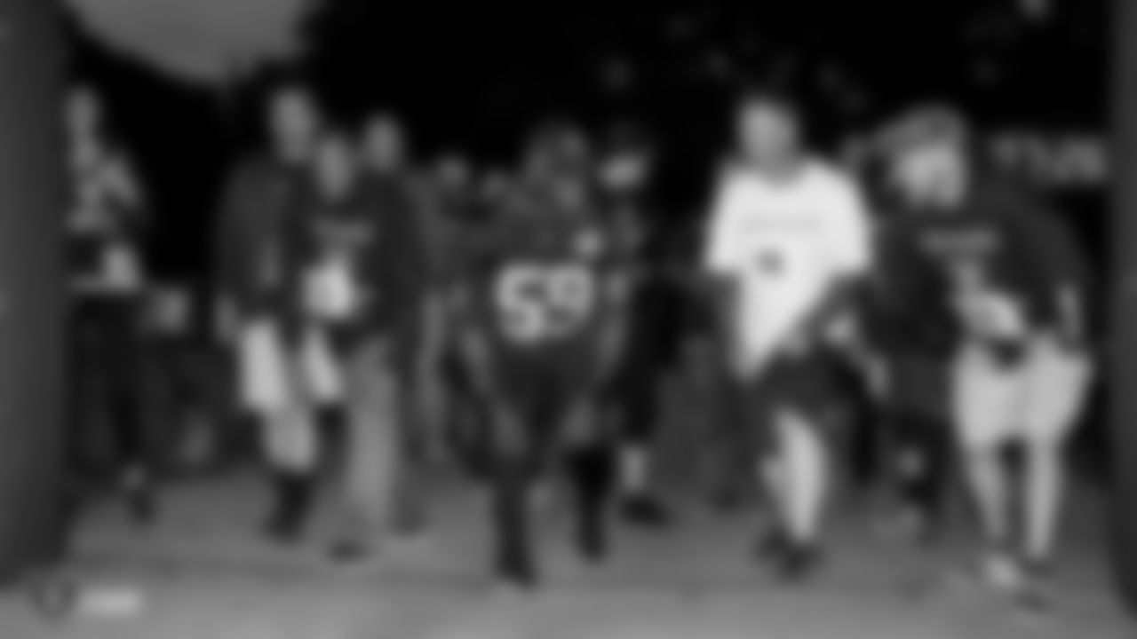 Raiders linebacker Tahir Whitehead (59) at the starting line with race participants at a Run Life's Course 5K run/walk around Lake Merritt.