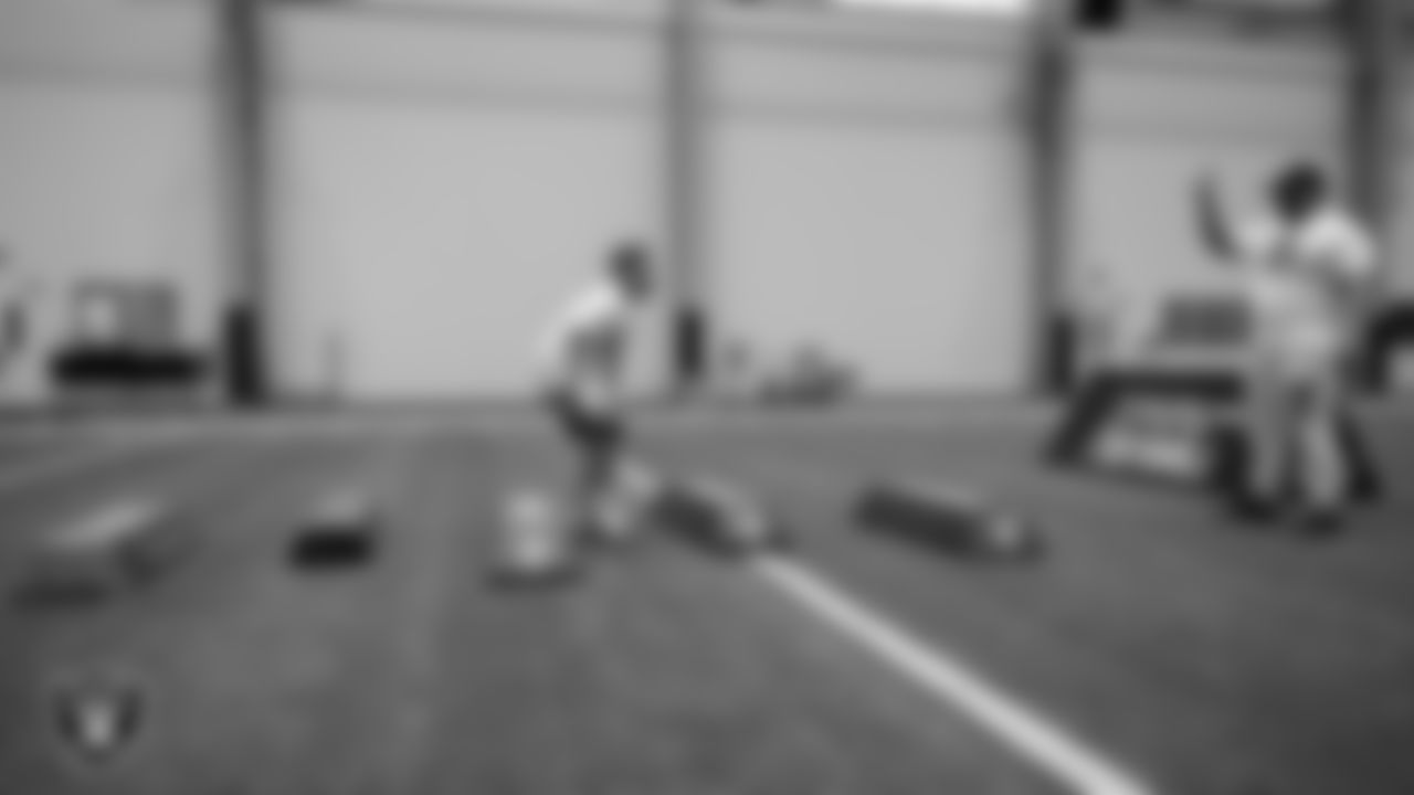 An athlete goes through a drill during the ELITE Academy at Las Vegas Raiders Headquarters.