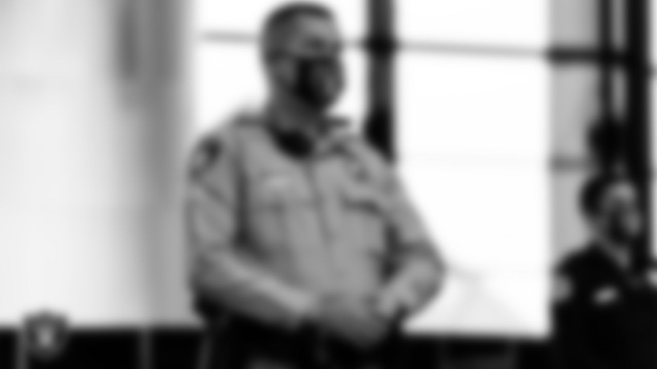 A member of the Las Vegas Metropolitan Police Department waits to light the Al Davis Memorial Torch before the Las Vegas Raiders regular season home game against the Indianapolis Colts.