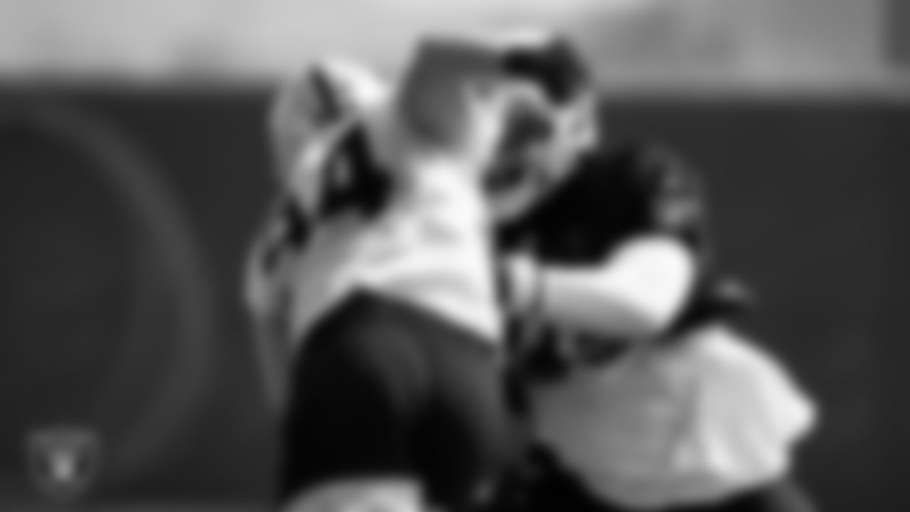 Las Vegas Raiders defensive end Carl Nassib (94) and tackle Alex Leatherwood (70) during practice at Intermountain Healthcare Performance Center.