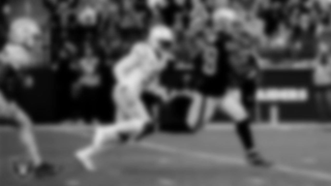 Las Vegas Raiders running back Josh Jacobs (28) rushes for a 20-yard touchdown during the regular season home game against the Los Angeles Chargers at Allegiant Stadium.