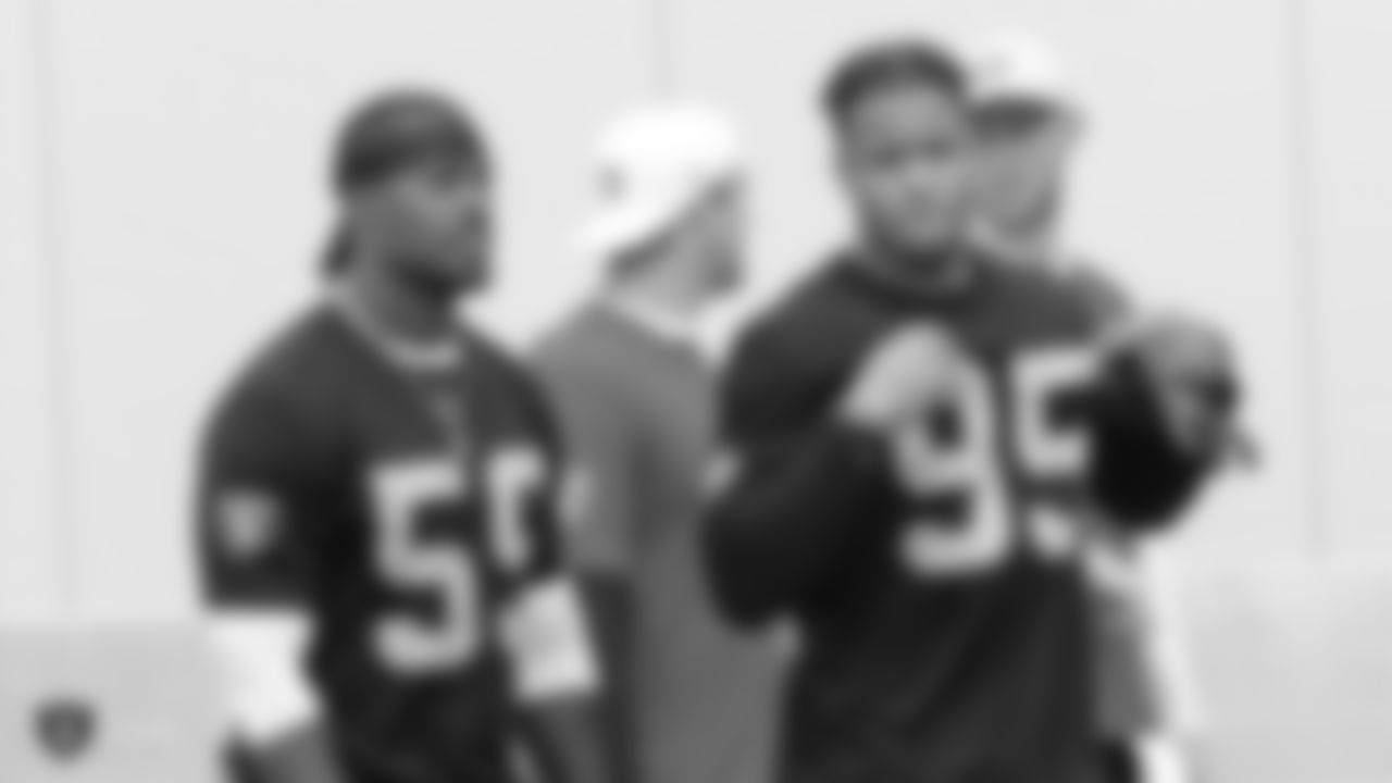 Raiders linebacker Tahir Whitehead (59) and defensive end Quinton Bell (95) at a workout during phase two of the offseason program at the Raiders Practice Facility in Alameda, Calif.