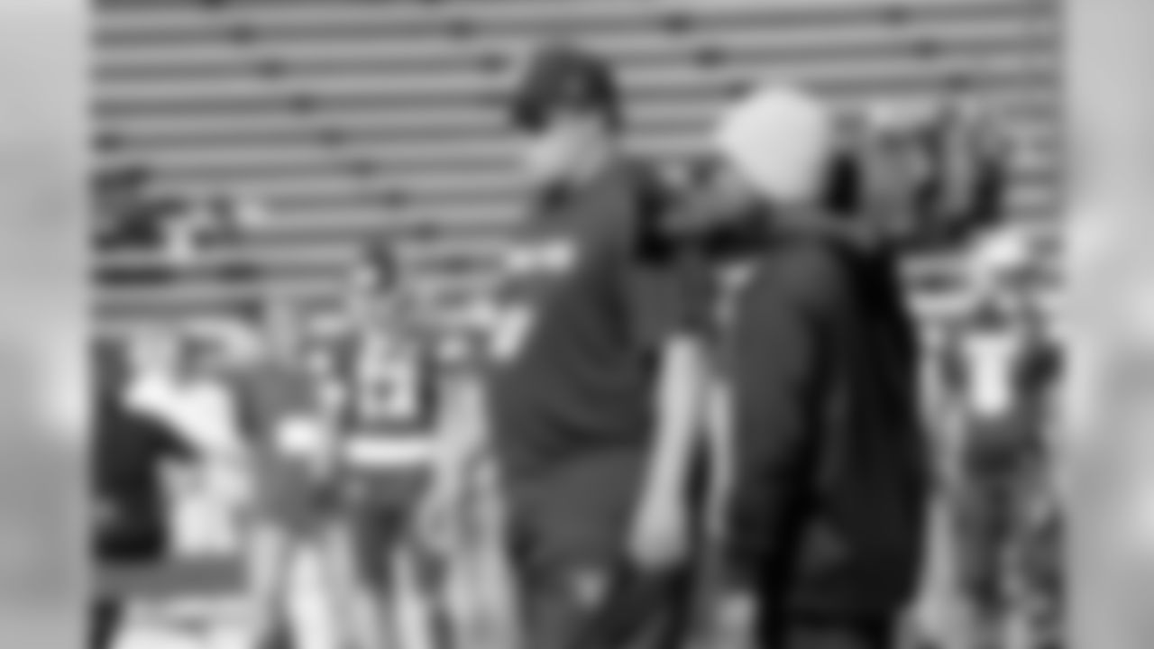 General Manager Reggie McKenzie observes the players at practice.