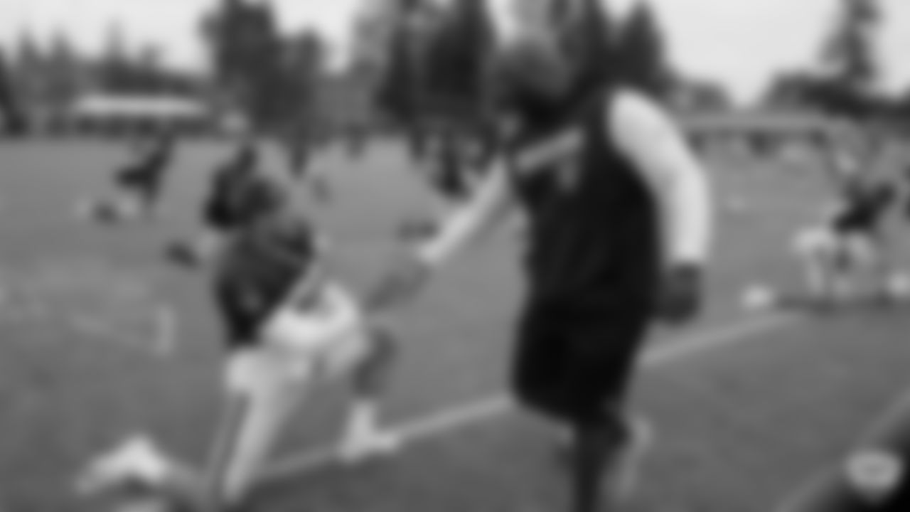 Raiders safety Dallin Leavitt (32) and assistant defensive backs coach Taver Johnson on the field for practice at 2019 Training Camp.