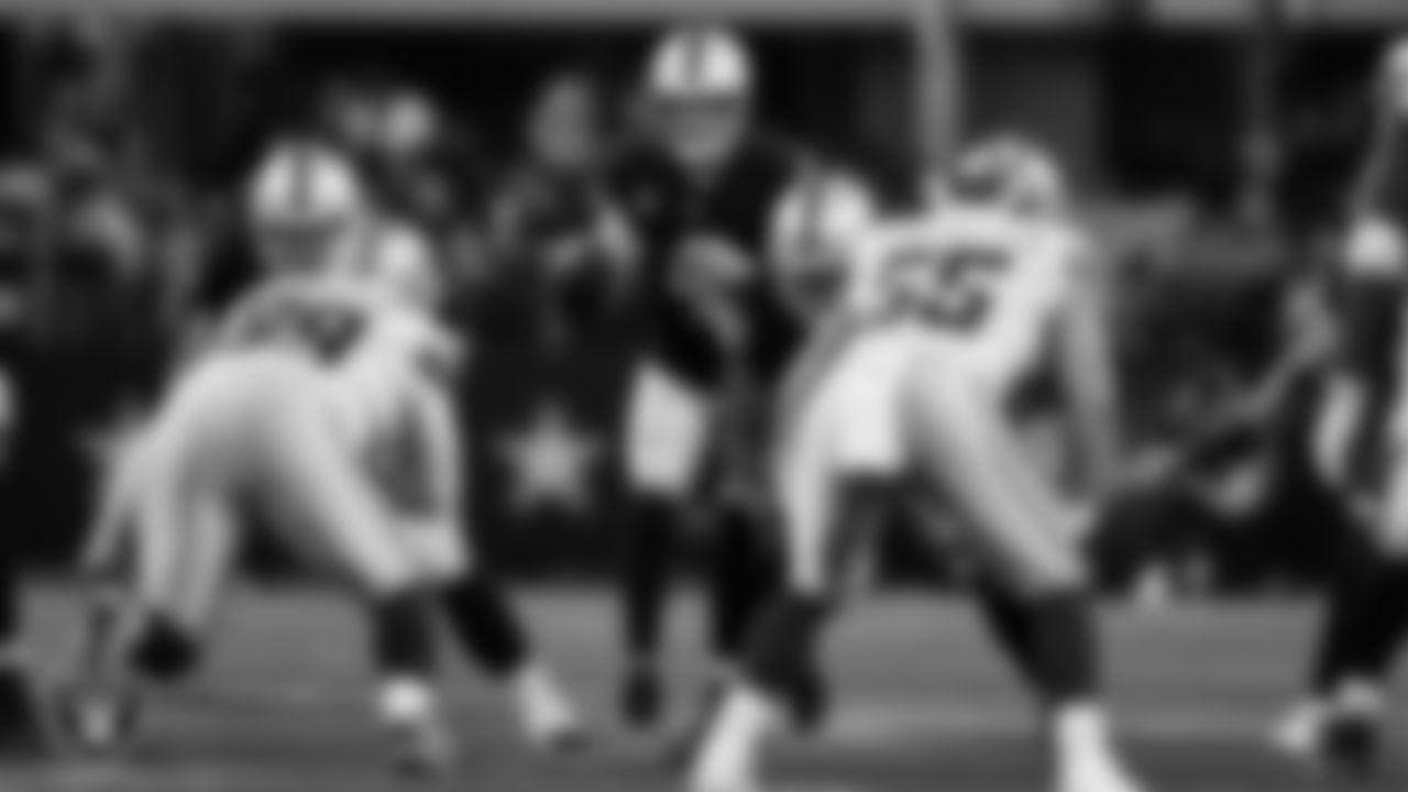 Las Vegas Raiders quarterback Derek Carr (4) receives the snap during the regular season away game against the Dallas Cowboys.