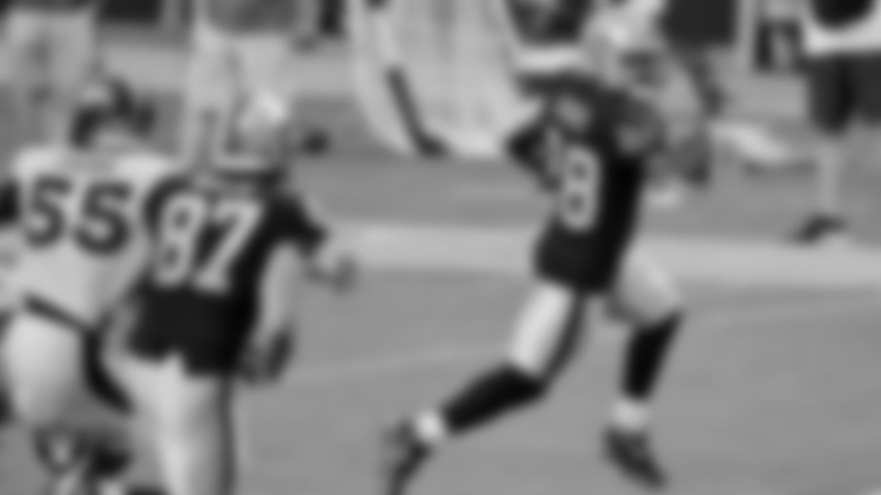 Las Vegas Raiders running back Josh Jacobs (28) rushes for a 5-yard touchdown during the regular season game against the Denver Broncos at Allegiant Stadium.