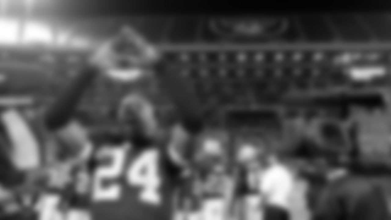 Raiders cornerback Charles Woodson (24) celebrates on the sidelines after returning a fumble 25-yards for a touchdown during the regular season home game against the San Diego Chargers.