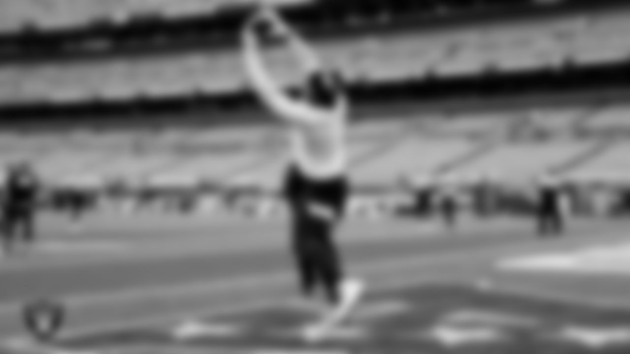 The Raiders warm up before the regular season game against the Cleveland Browns at FirstEnergy Stadium.
