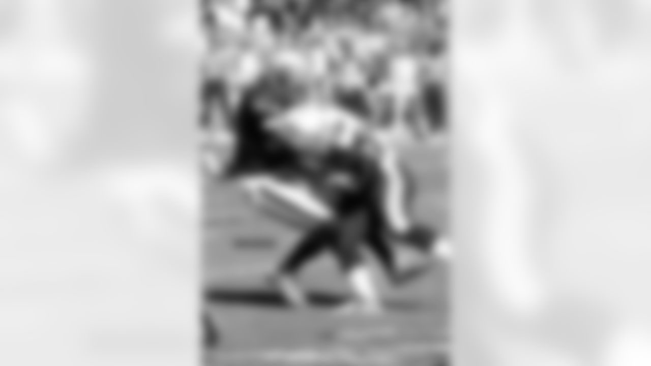 FS Charles Woodson makes the tackle.