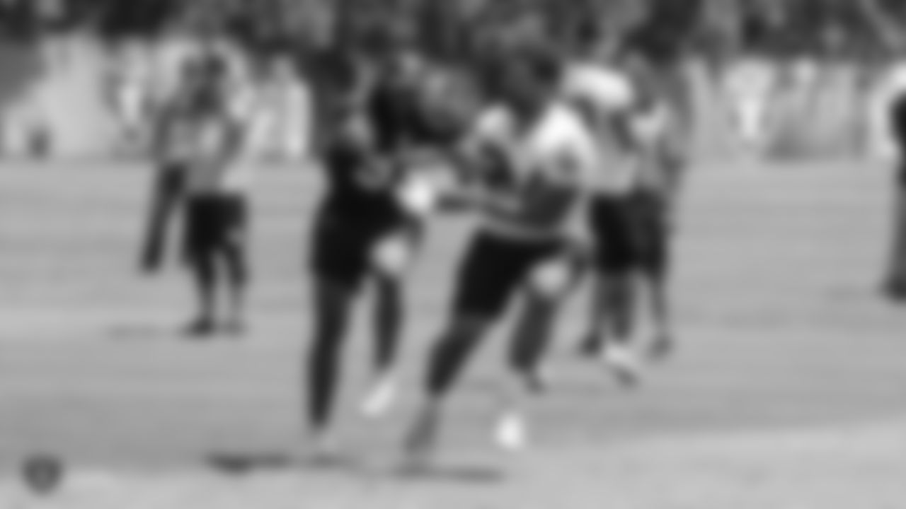 Oakland Raiders linebacker Azeem Victor (57) and running back Chris Warren (34) at a Mandatory Minicamp at the Oakland Raiders Practice Facility, Thursday, June 14, 2018, in Alameda, California.