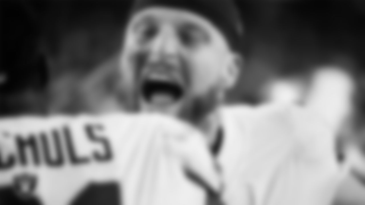 Las Vegas Raiders defensive end Maxx Crosby (98) celebrates on the field after the regular season away game against the Denver Broncos at Empower Field at Mile High.