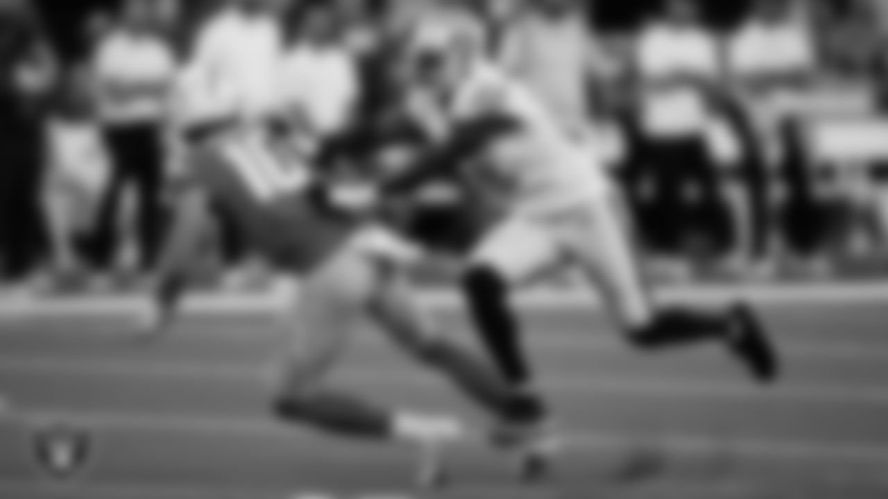 Las Vegas Raiders defensive end Yannick Ngakoue (91) knocks downs the quarterback during the regular season away game against the Los Angeles Chargers.